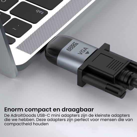 USB-C adapter met VGA-connector aangesloten op een laptop voor beeldverbinding