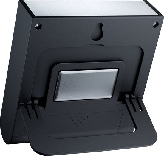 Zwart apparaat met een opklapbare standaard en metalen paneel aan de bovenkant