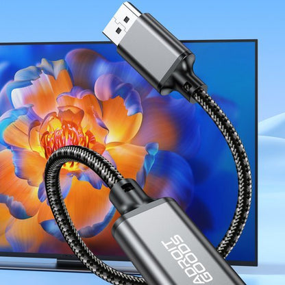 Zwarte gevlochten kabel met USB-C-connector verbonden met een kleurrijk schermachtergrond
