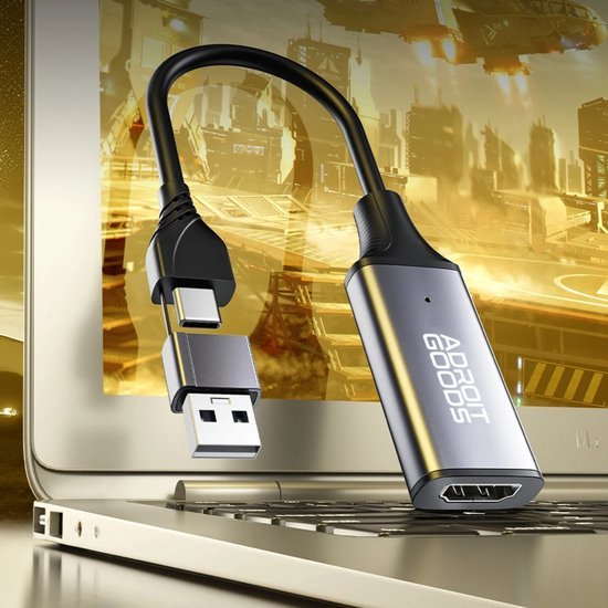 Zwarte en zilveren adapterkabel met USB-C, USB en HDMI aansluitingen naast laptop