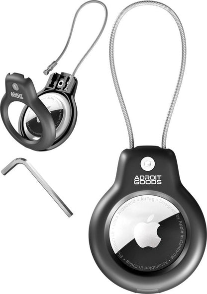 Zwarte ronde houder met metalen koord en sleutelgereedschap voor een Apple AirTag accessoire