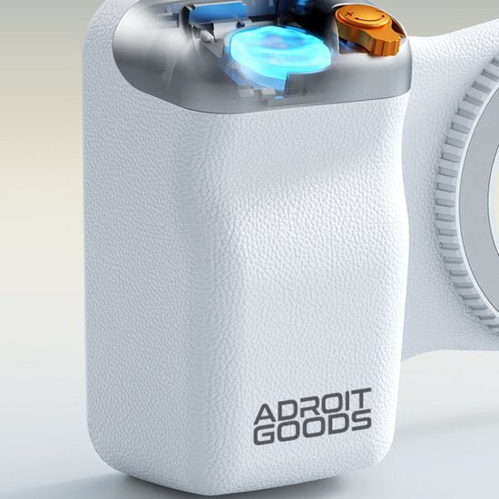 Close-up van een wit handvat met visible interne blauwe en oranje componenten en Adroit Goods logo.