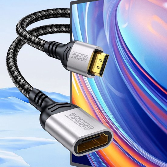 Stevig gevlochten zwart HDMI-verlengkabel met metalen behuizing en gouden connectoren naast scherm