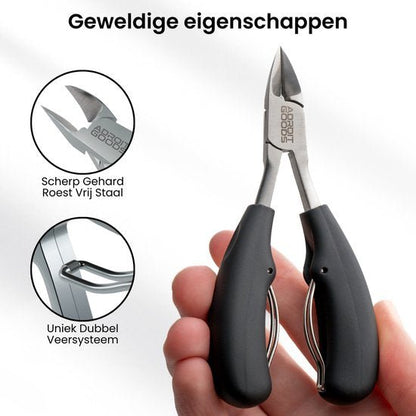 Hand met zwarte tang met scherpe roestvrijstalen snijkant en dubbel veersysteem