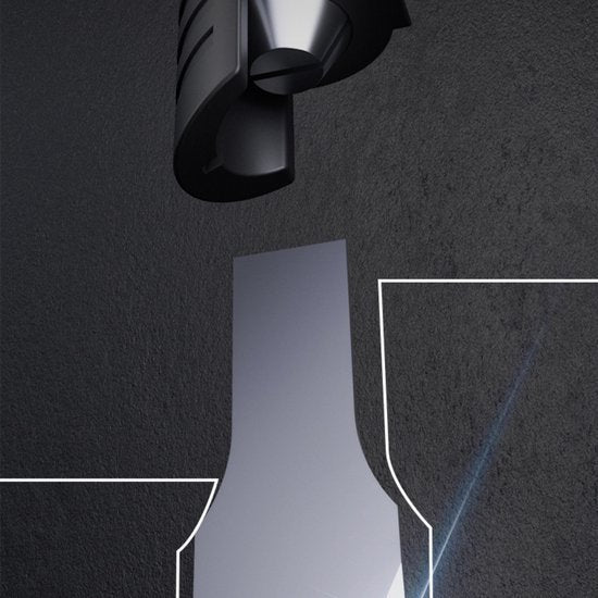 Zwart metalen apparaat boven een glad oppervlak met donkere achtergrond en lichte lijnen