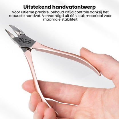 Hand houdt een robuust metalen kniptool met zilveren en roségouden afwerking vast
