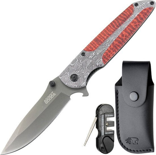 Vouwmes met grijze lemmet en rood patroon op handvat inclusief slijper en zwarte leren hoes