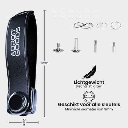 zwarte sleutelhanger met metalen bevestigingen en accessoires, lichtgewicht en compact ontwerp