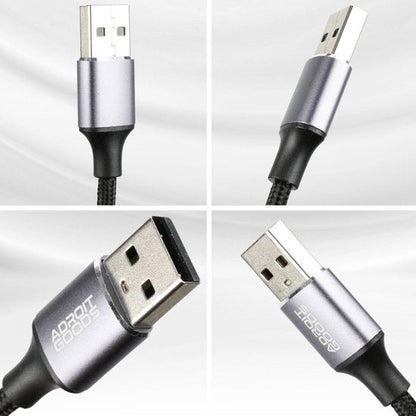 Unieke USB-kabel met metallic behuizing en gevlochten zwarte kabel in verschillende hoeken zichtbaar