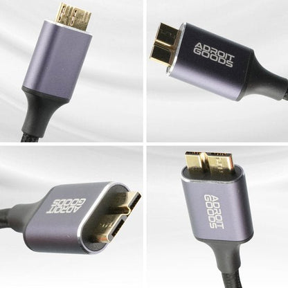 close-up van een robuuste paarsgrijze kabelconnector met gouden contacten van Adroit Goods