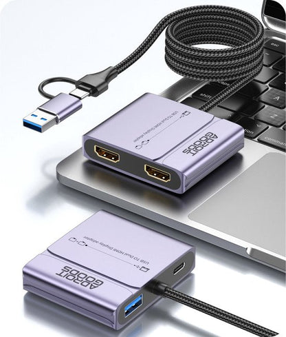 paarskleurige USB naar dubbele HDMI adapter met gevlochten kabel op laptop geplaatst