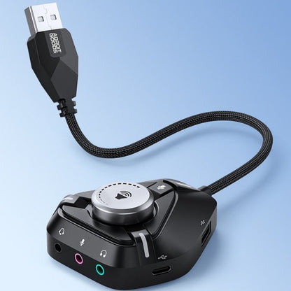 zwarte audio USB-adapter met draaiknop en meerdere poorten voor headset en microfoon