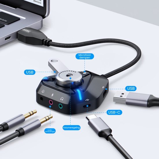 Zwarte multifunctionele USB-adapter met volume- en microfoondempering aansluitingen voor audio.