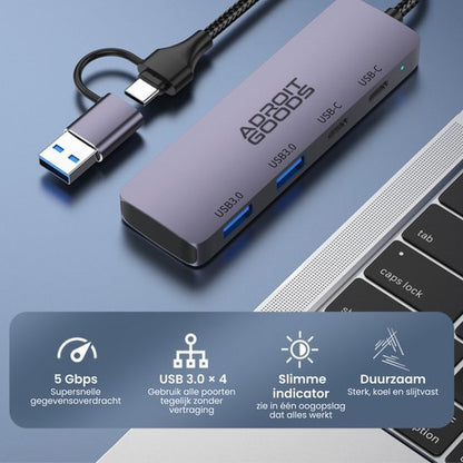 usb-hub met vier usb 3.0 en twee usb-c poorten naast laptop toetsenbord