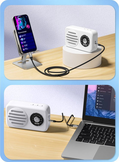 Witte retro-stijl speaker met draaiknop aangesloten op smartphone en laptop via kabels