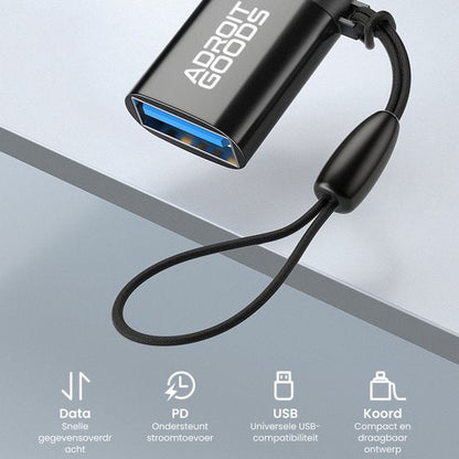 Zwarte USB-adapter met blauwe aansluiting en draagkoord voor snelle gegevensoverdracht