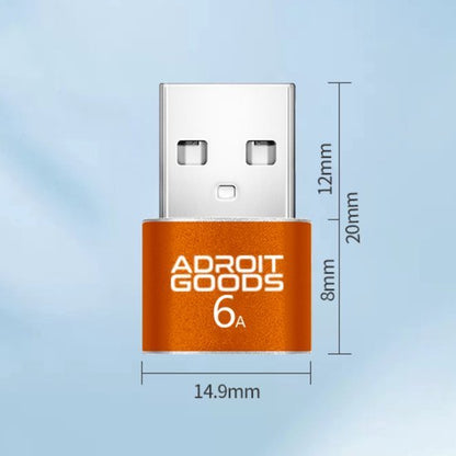 oranje usb-adapter met afmetingen en merknaam Adroit Goods zichtbaar