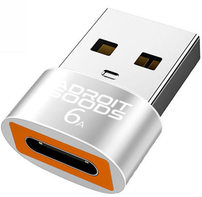 kleine zilveren usb-adapter met oranje accent en witte tekst voor opladen of dataoverdracht