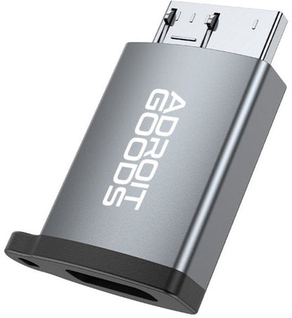 grijze metalen adapter met zwarte onderkant en witte adroit goods tekst zichtbaar