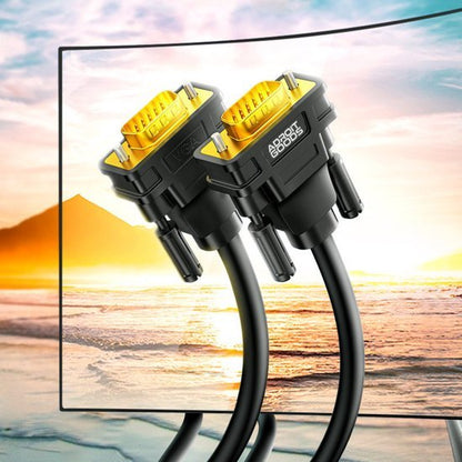 Twee zwarte AdroitGoods VGA-kabels met gouden connectoren tegen zonsondergangstrandachtergrond