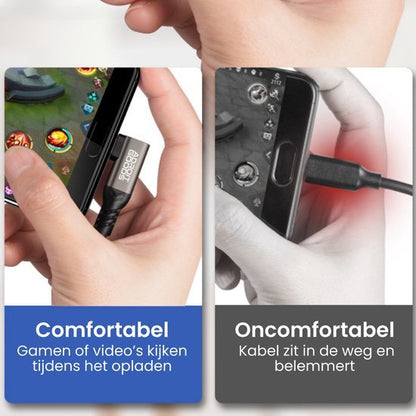 Hand houdt mobiel met oplader omhoog en naar beneden met kabel die in de weg zit bij gamen