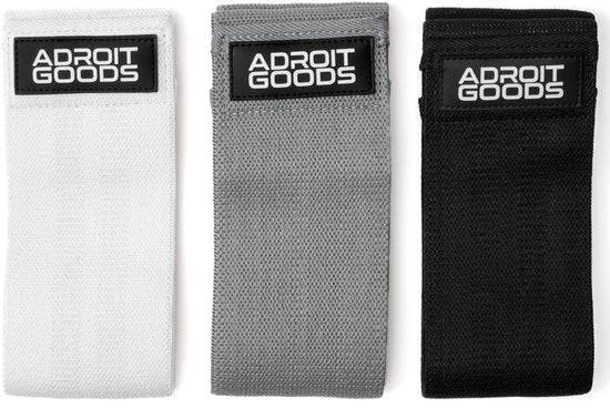 Set van drie AdroitGoods fitness weerstandsbanden in wit, grijs en zwart, netjes gerangschikt.