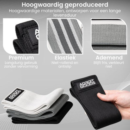Set ademende en elastische banden in verschillende kleuren met AdroitGoods logo, hand houdt zwarte band vast